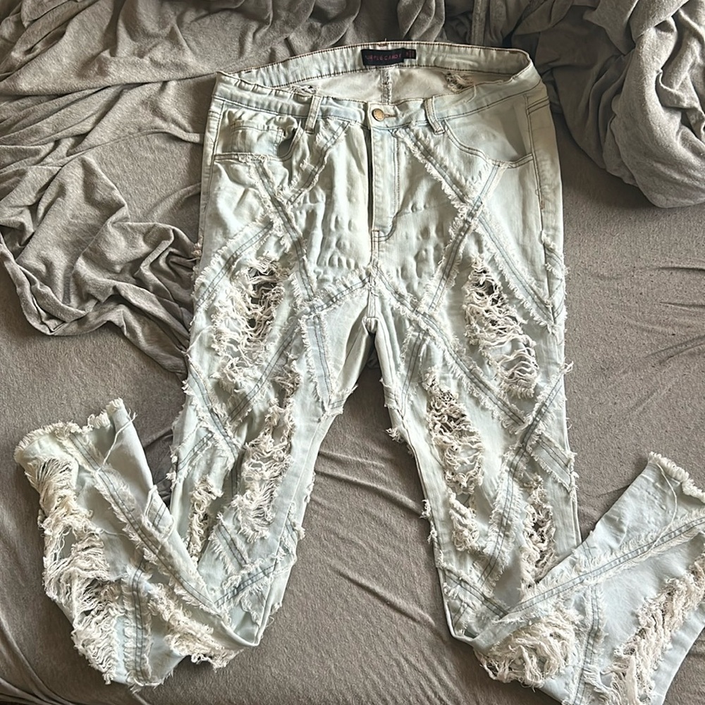 Distressed light blue jeans
